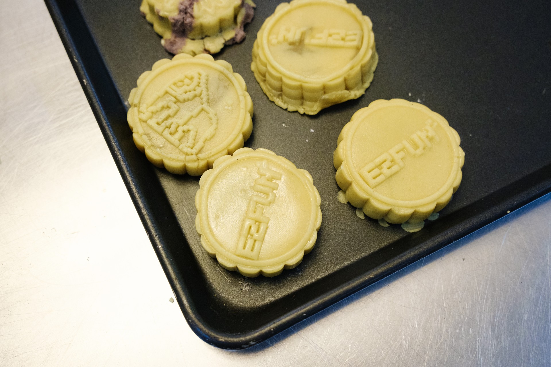 Freshly moulded mooncakes display traditional Mid Autumn patterns